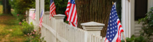 White picket fence with flags
